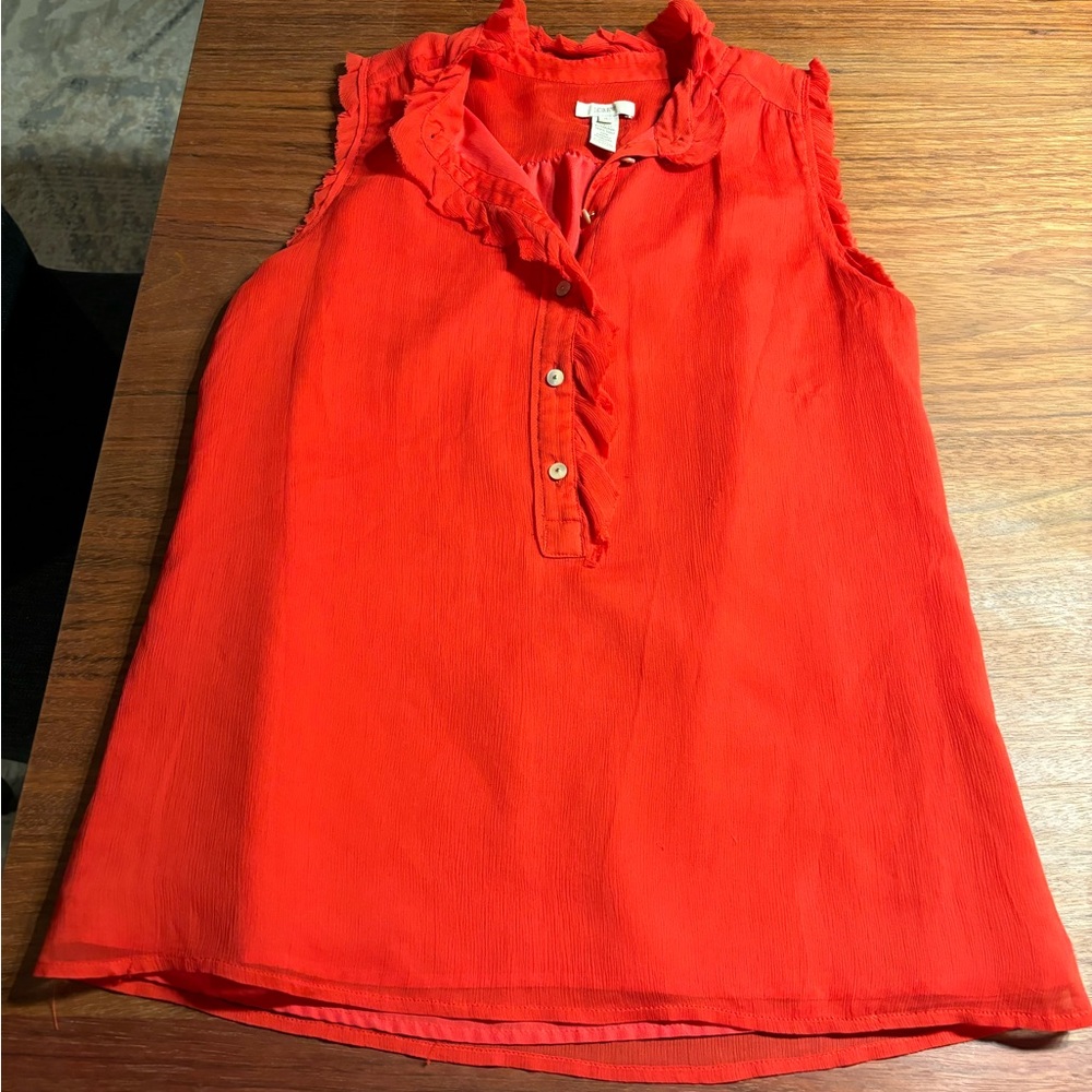Bright red sleeveless blouse